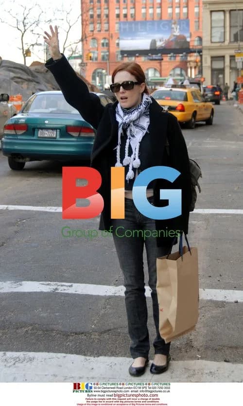 Julianne Moore hails a cab in Soho