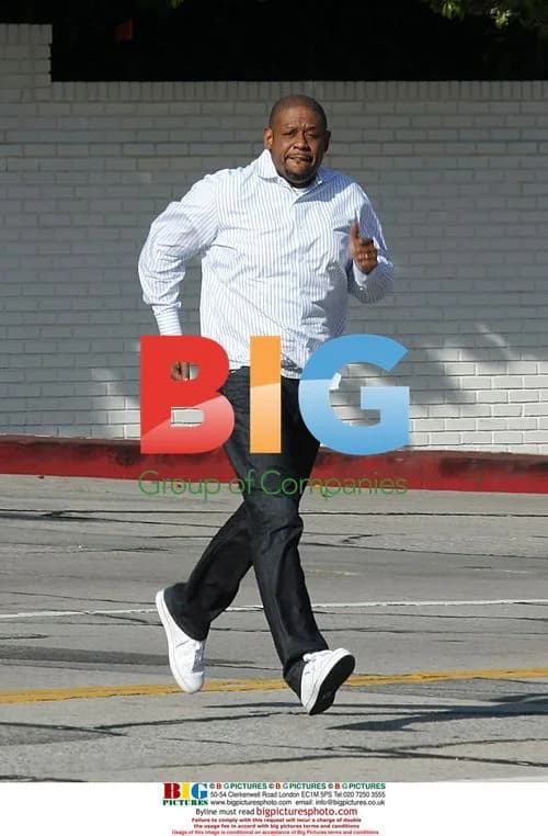 Forest Whitaker runs across Sunset Blvd