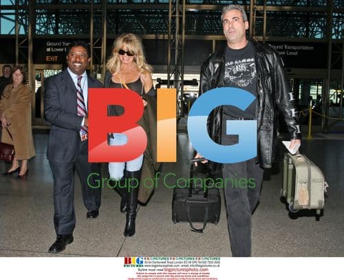 Goldie Hawn Departs LAX with Mystery Man