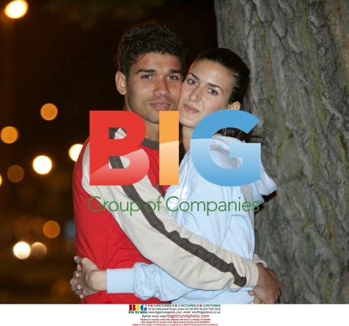 Eduardo da Silva and fiancee Andrea pose near stadium