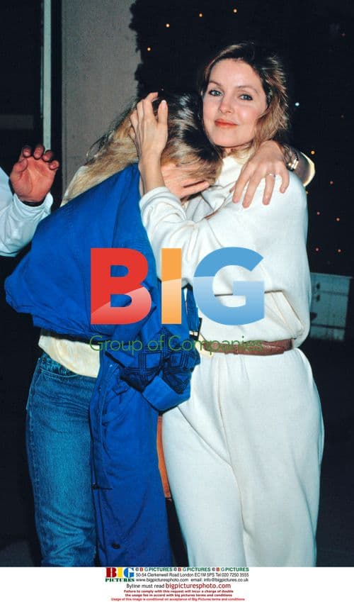 Priscilla Presley shielding Lisa Marie