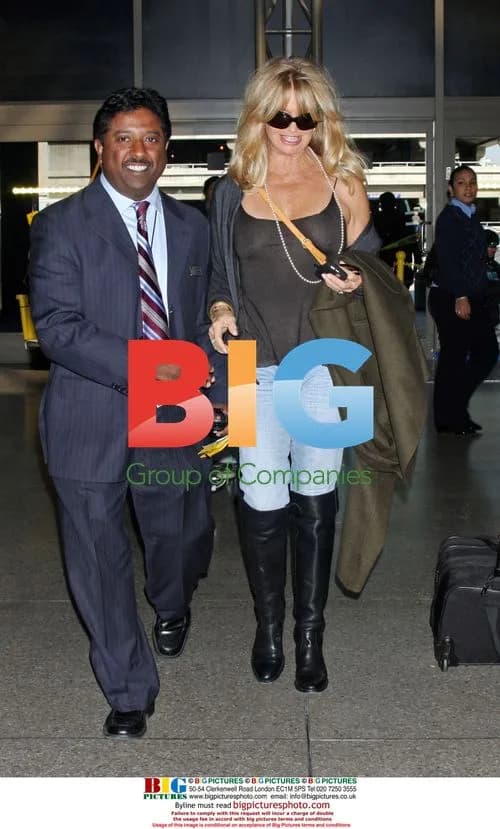 Goldie Hawn Departs LAX with Mystery Man