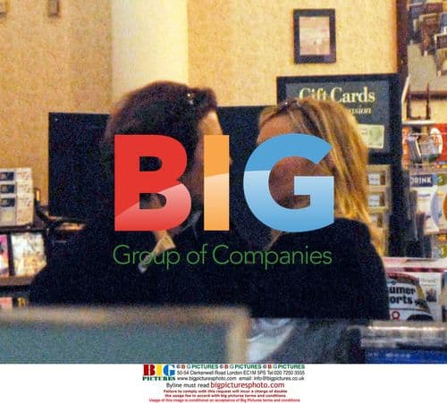 Uma Thurman and Arpad Busson kissing in Barnes & Noble