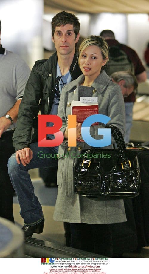 Perry Farrell and wife Etty Lau at LAX