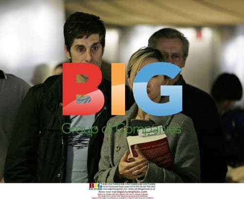 Perry Farrell and wife wait for luggage at LAX