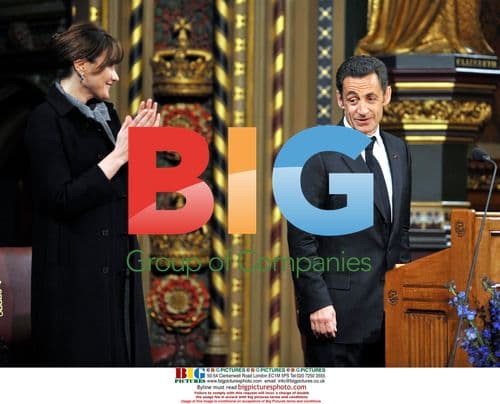 Carla Bruni-Sarkozy applauds French President