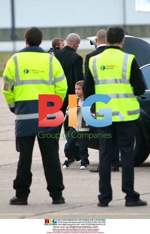 Victoria Beckham and Kids Arrive in Paris