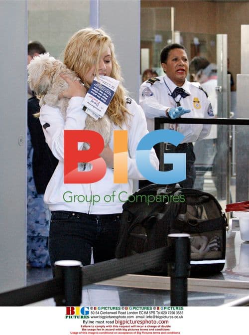 Aly Michalka Departs LAX with Dog, Poses with Fan