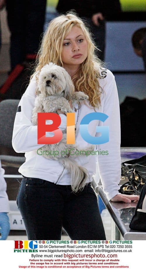 Aly Michalka Departs LAX with Dog, Poses for Fan