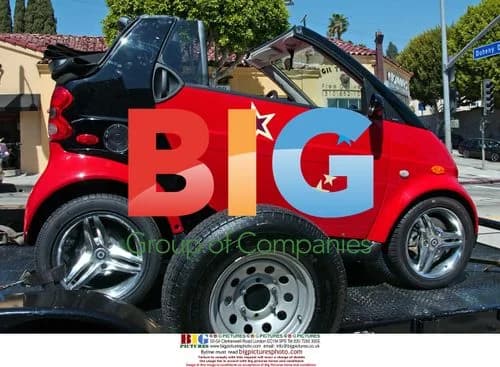Miley Cyrus in Convertible Smart Car