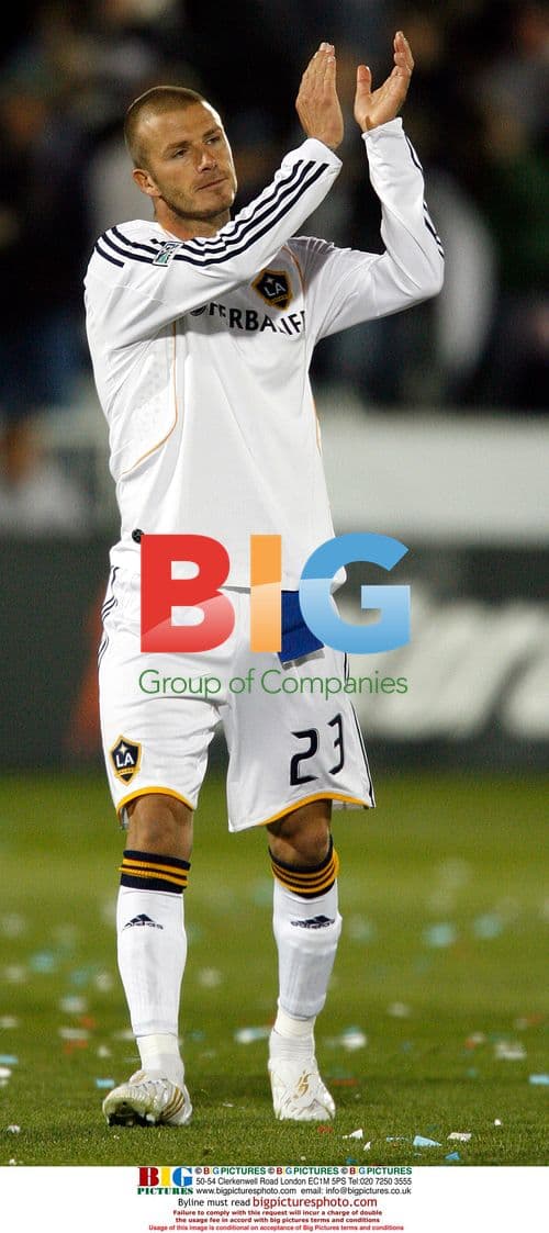 David Beckham applauds fans at MLS opener