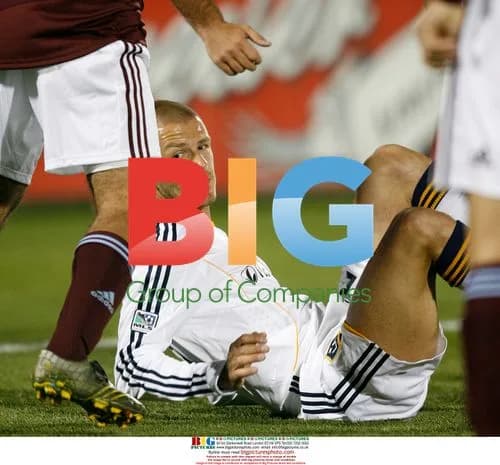 David Beckham tumbles on pitch