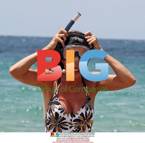 Janice Dickinson Splashes in Hawaiian Surf