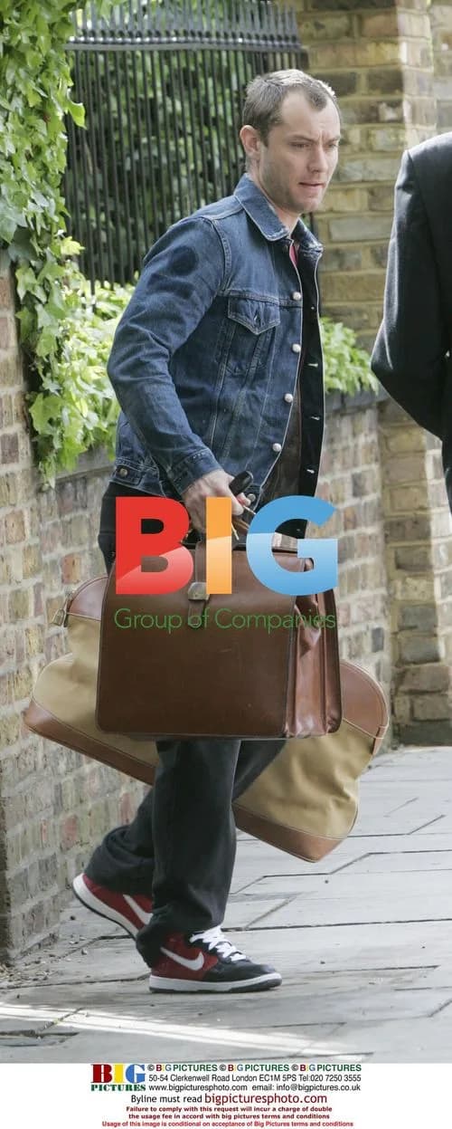 Jude Law waiting for a lift in London