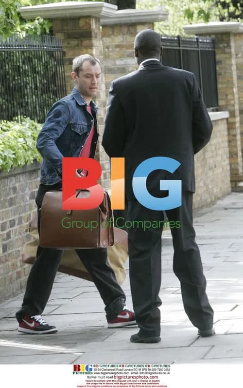 Jude Law waits for lift in London