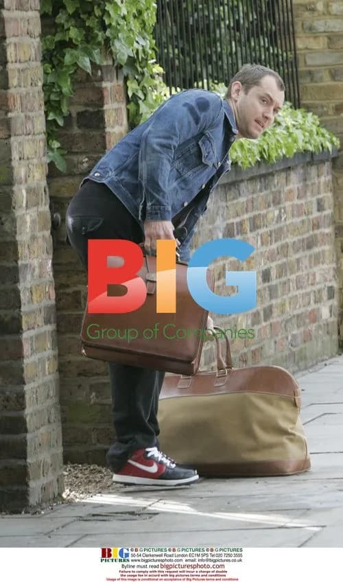 Jude Law waits for a lift in London
