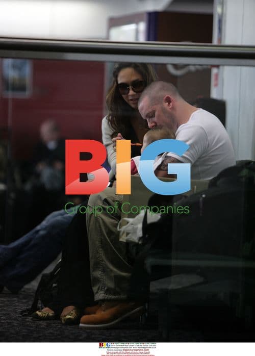 Myleene Klass with partner and baby at Heathrow