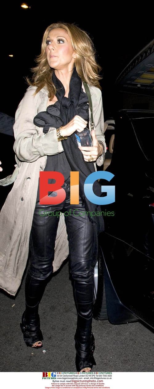 Celine Dion in Unusual Eyelashed, Open-Toed Boots