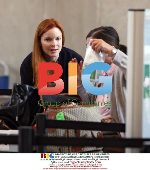 Marcia Cross and family depart LAX