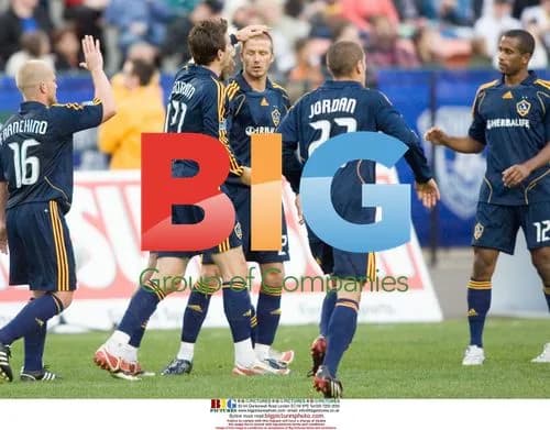 Alan Gordon pats David Beckham during soccer game