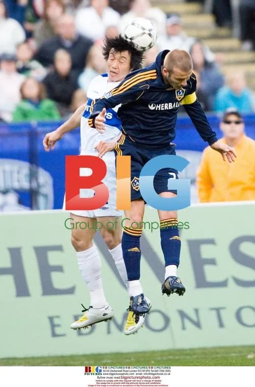David Beckham of LA Galaxy heads the ball