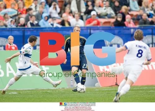 David Beckham Kicks Ball Between Whitecaps Players