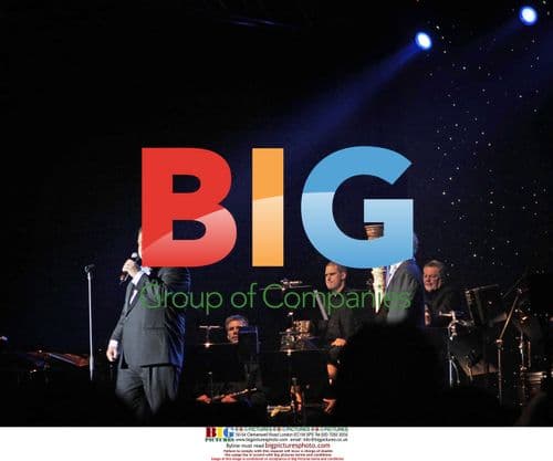 Paul Potts performs on stage in Stockholm