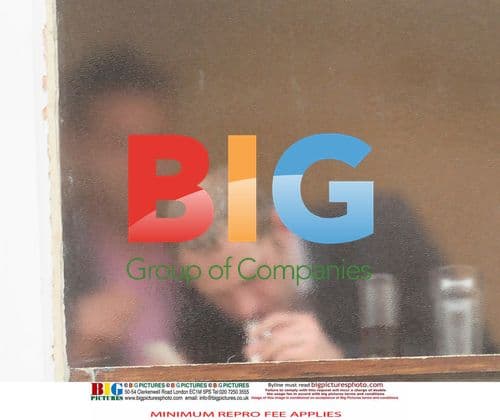 Two men taking drugs in pub