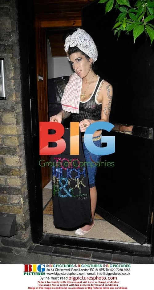 Amy Winehouse Cleans House in Char Lady Outfit