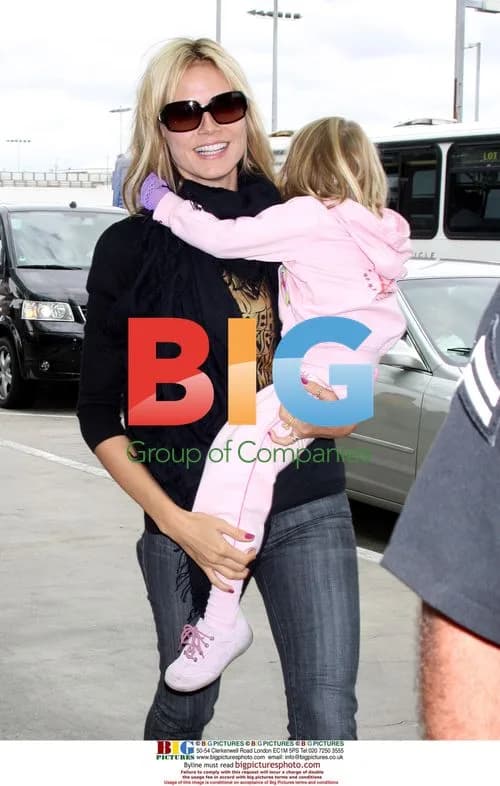 Seal kisses Heidi Klum goodbye at LAX