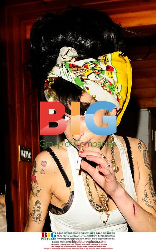 Amy Winehouse taking out trash at home