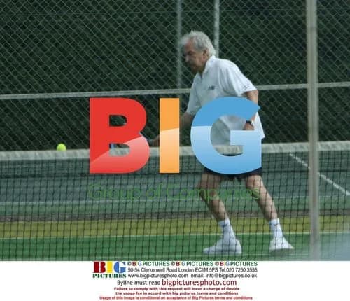 Des Lynam playing doubles tennis