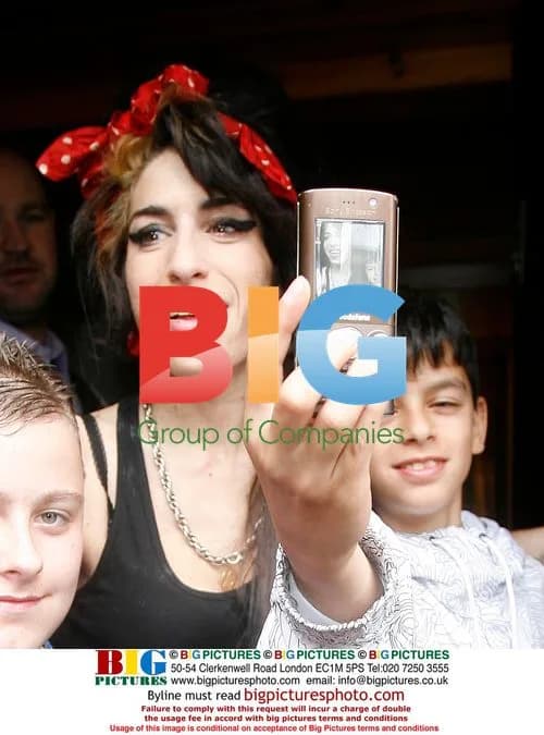 Amy Winehouse Entertains Kids in London