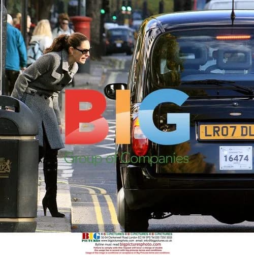 Kelly Brook leaves house in colorful trainers