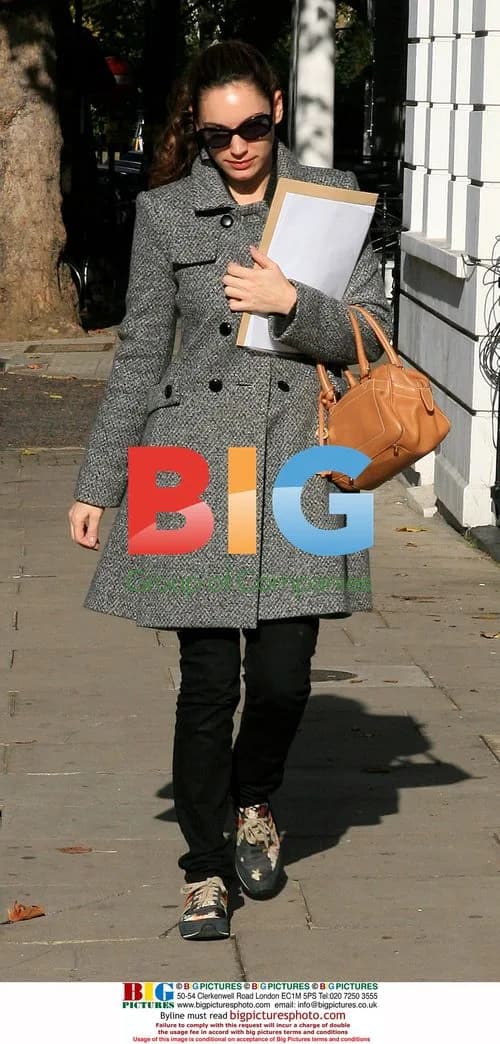 Kelly Brook leaves house in colorful trainers