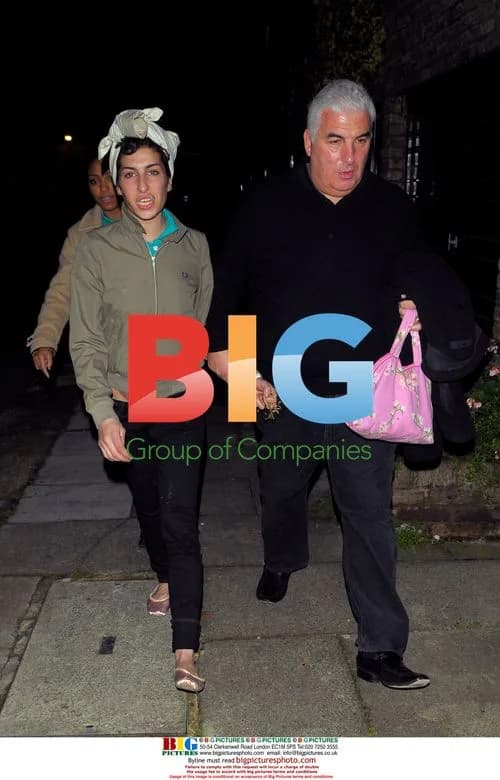 Singer Amy Winehouse Leaves Home with Father
