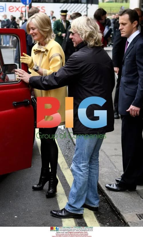 Rick Parfitt and wife leaving Dorchester Hotel