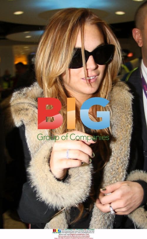 Lindsay Lohan & Samantha Ronson at Heathrow Airport