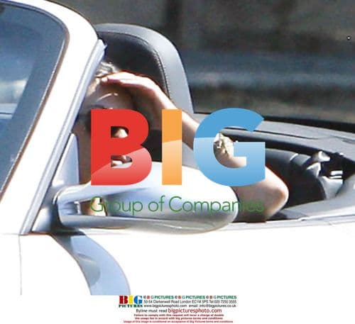 Mila Kunis on set of "Extract"