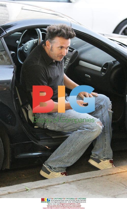 Harland Williams feeding parking meter in LA