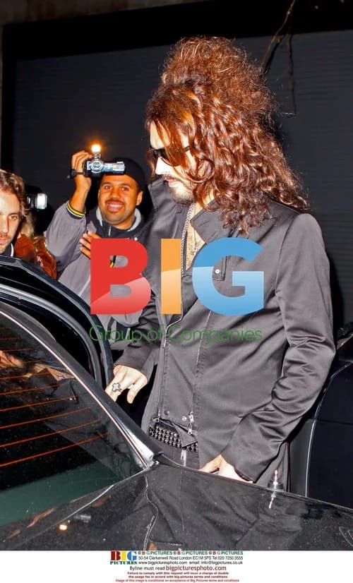 Russell Brand Exits Hotel for Comedy Central