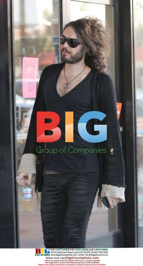 Russell Brand does photo shoot, gets tattoo removal