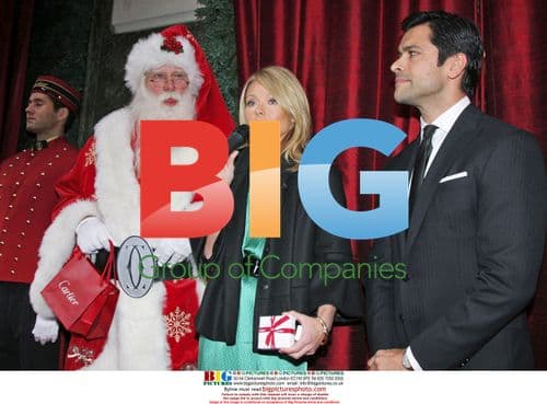 Kelly Ripa and Mark Consuelos with Santa Claus