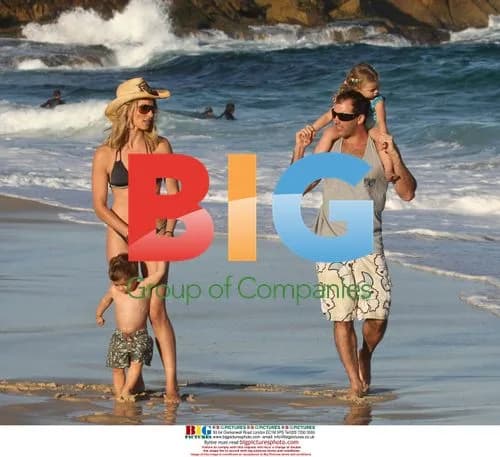 Dani Behr with family on beach in Australia