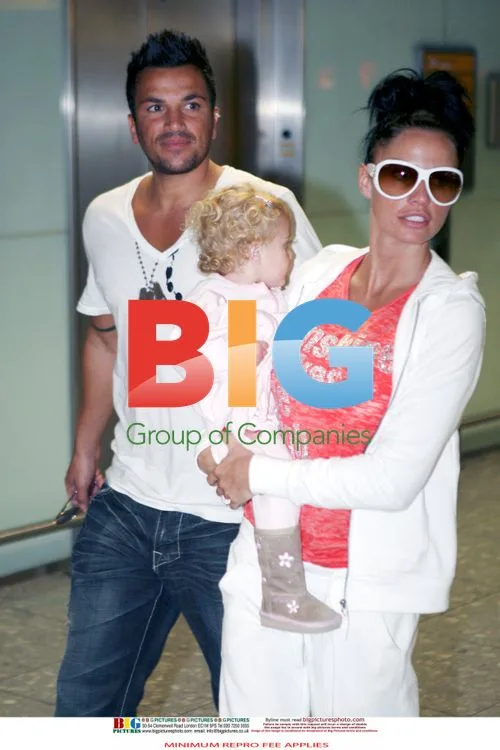 Katie Price, Peter Andre and daughter arrive in UK