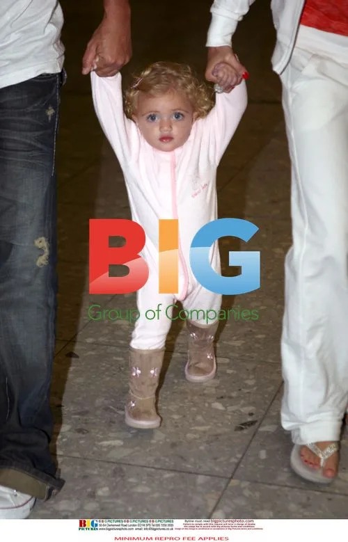 Katie Price, Peter Andre, and daughter arrive in UK