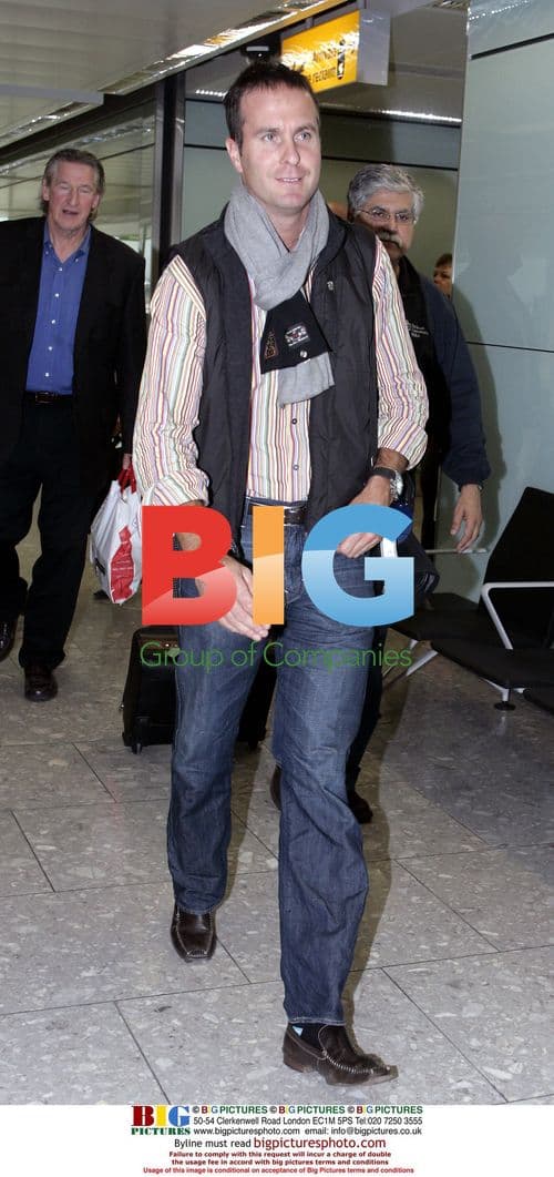 Michael Vaughan arrives home from India