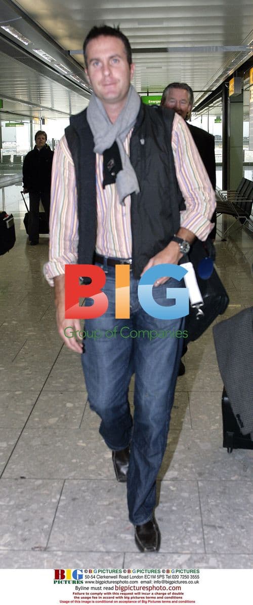 Michael Vaughan returns home from India