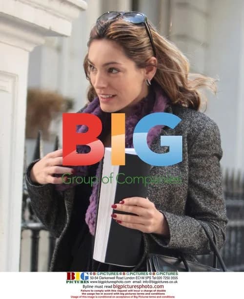 Kelly Brook looks at morning papers after boyfriend's exit