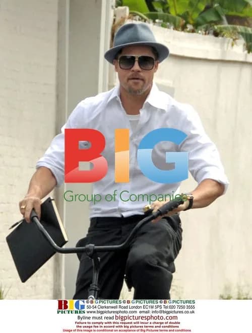 Brad Pitt cycles to meeting in New Orleans